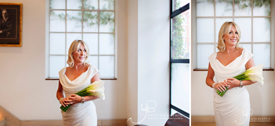 Wedding photography of the bride holding her lily bouquet at The Bluebird