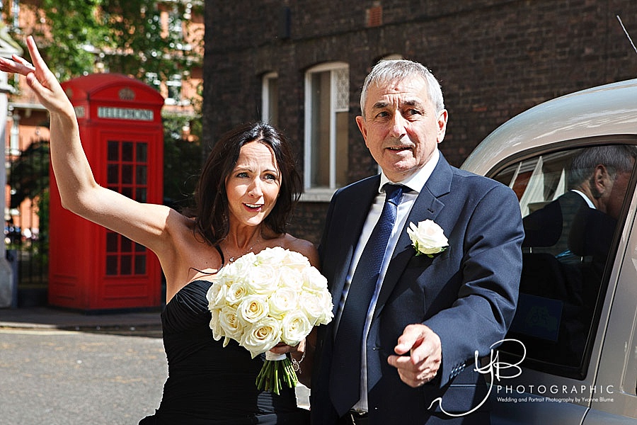 The bride arrives at Mayfair Library with her dad.