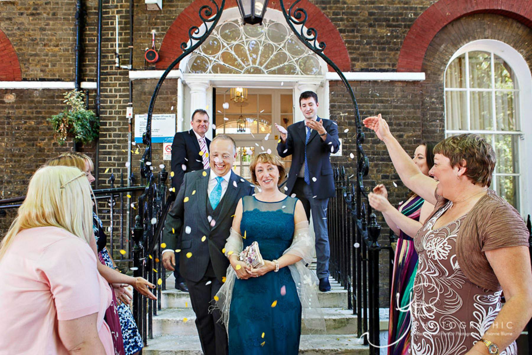 The bride and groom exit into a flurry of confetti after their Southwark Register Office wedding
