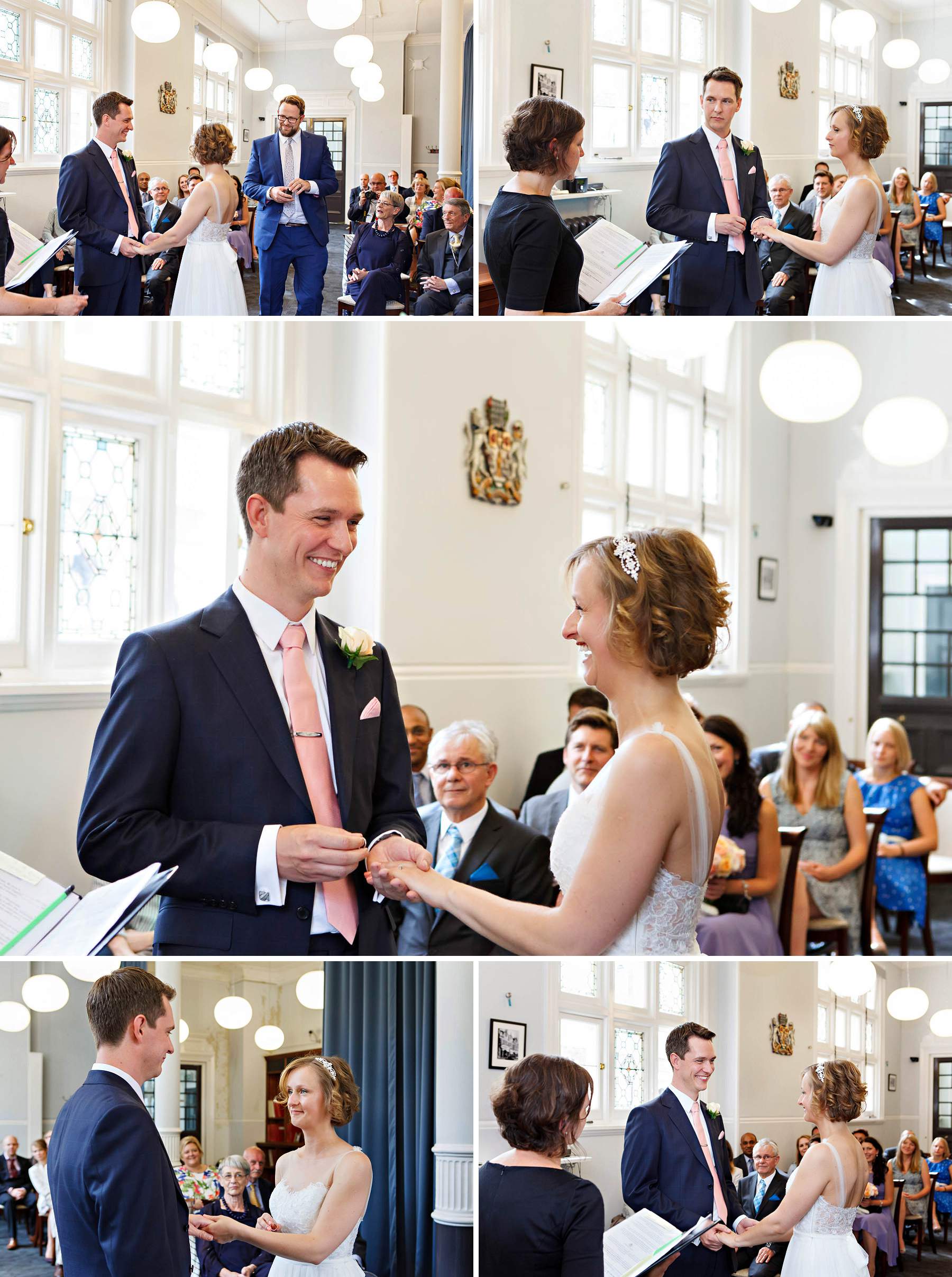 the bride and groom exchange rings during their Mayfair Library summer wedding ceremony.