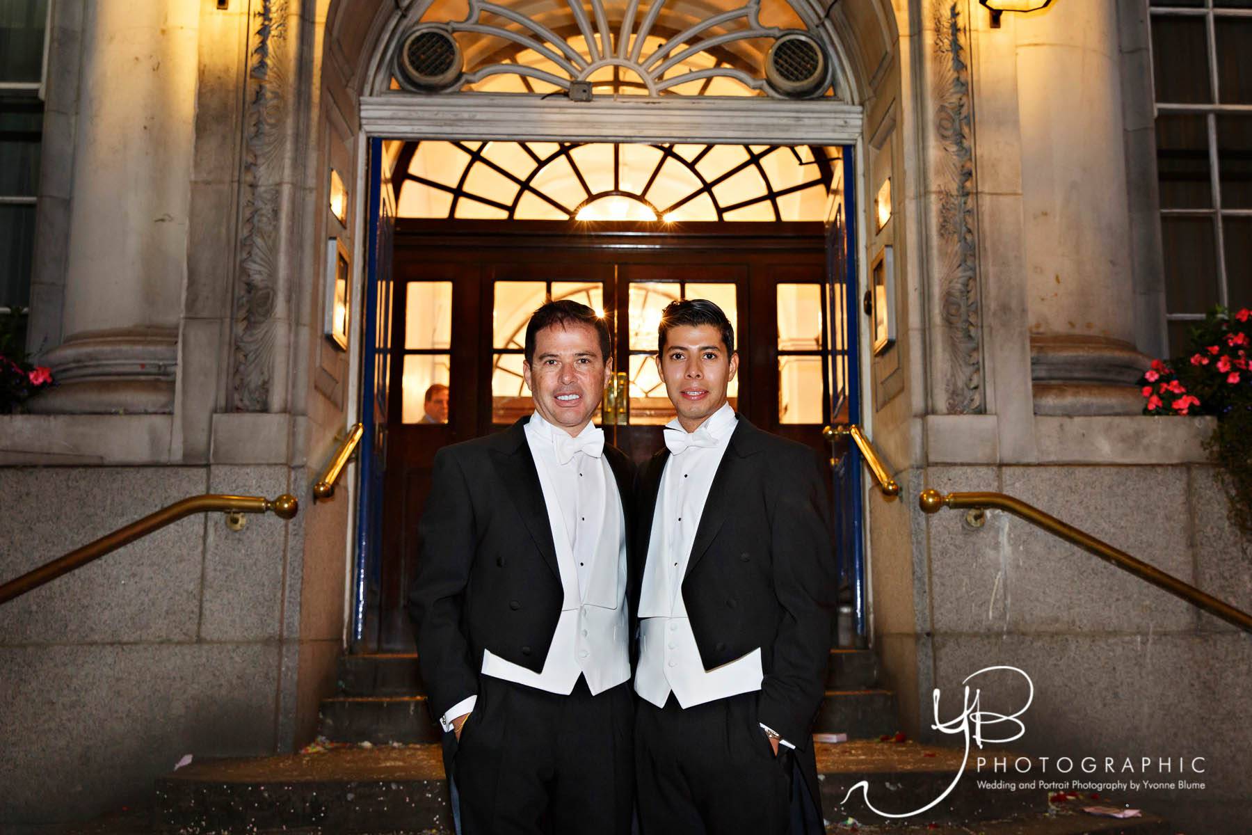 A winter wedding photo of two grooms on Kings Road in London. 