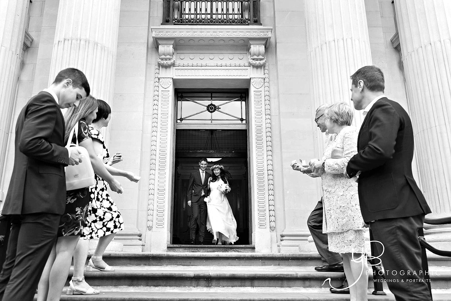 Bride and Groom leave the Old Marylebone Town Hall after their wedding ceremony
