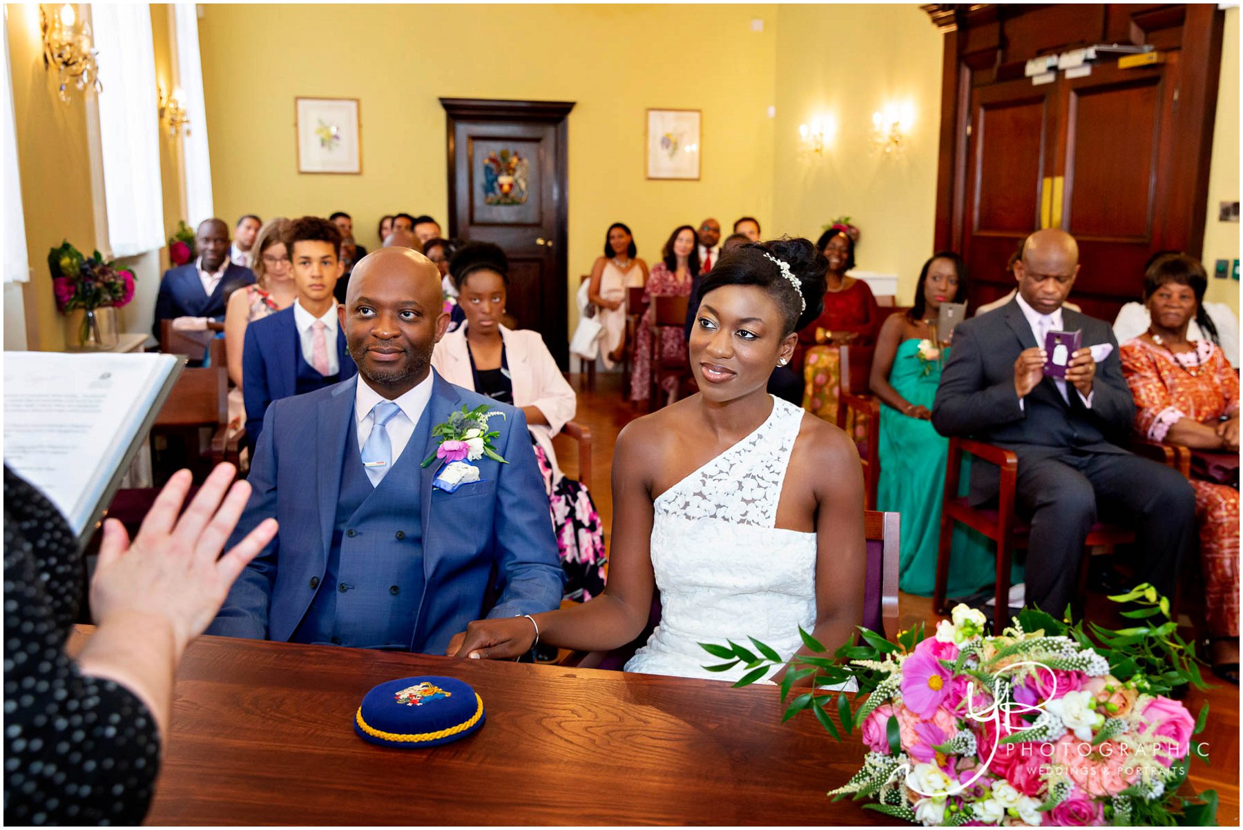 Bride and Groom listen carefully to the registrars introduction to their Brydon Room wedding ceremony | ybphotographic