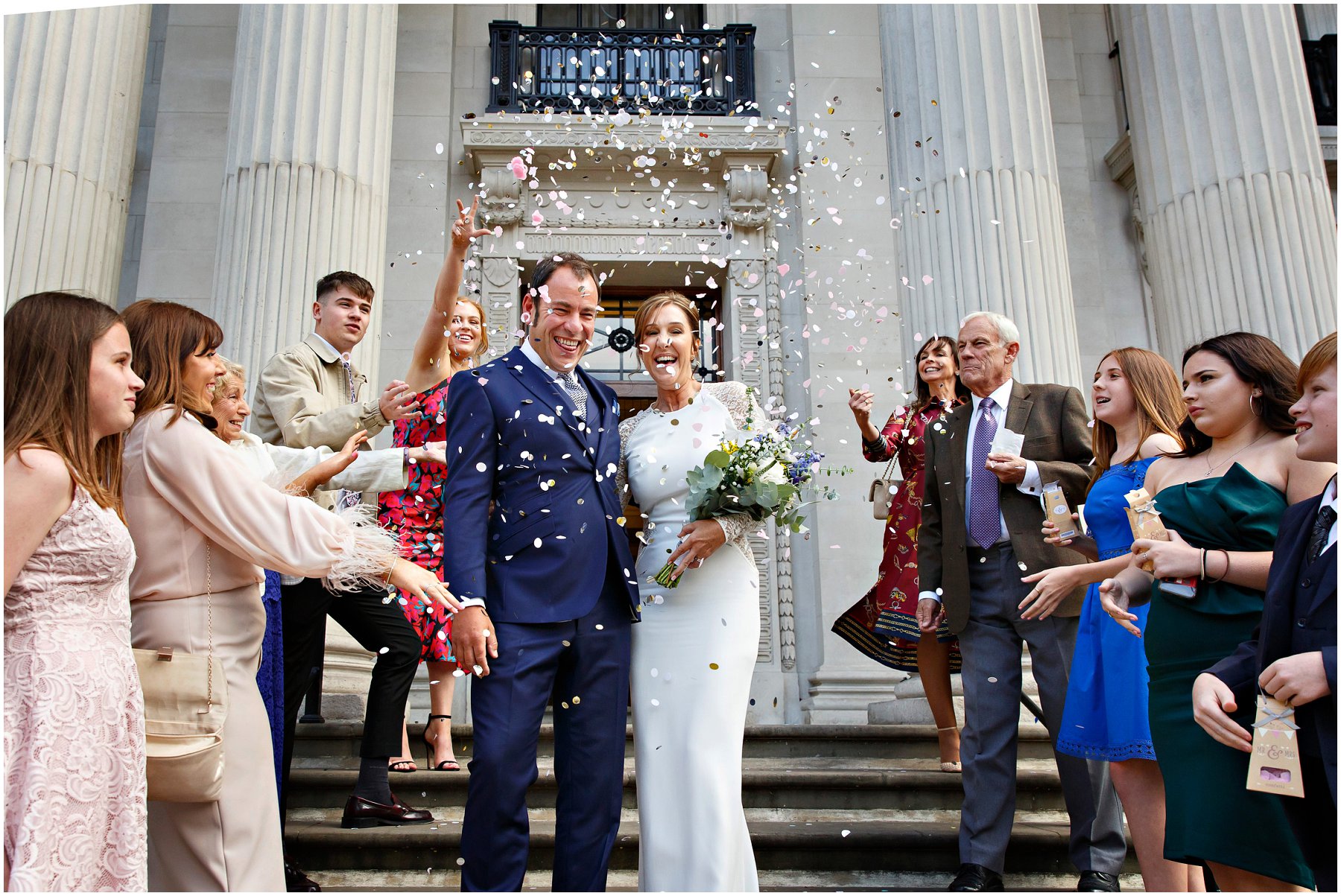 Confetti throw on the steps of The Old Marylebone Town Hall by YBPHOTOGRAPHIC