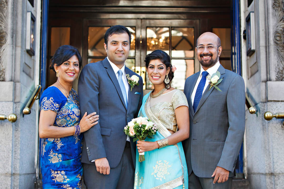 A family wedding photo on the famous steps of Chelsea Old Town Hall.