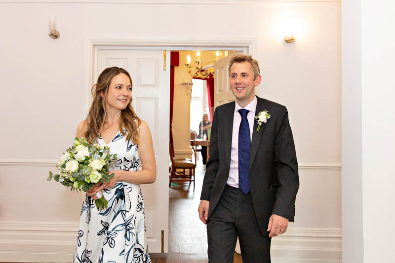 A bride and groom enter their Southwark wedding ceremony together.