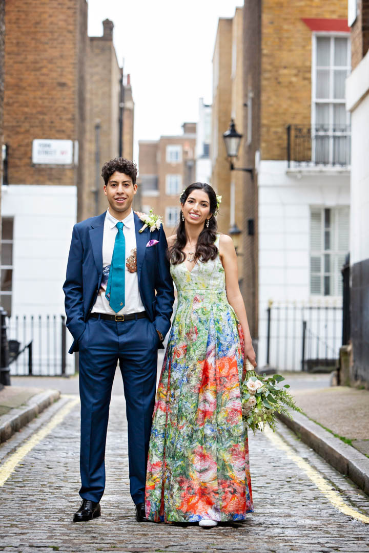 Bride and groom pose for relaxed wedding photos after their civil ceremony at The Old Marylebone Town Hall