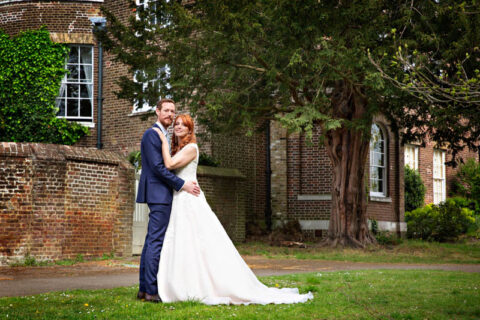 Bride and Groom wedding portrait with Morden Park House in the background.